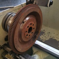 A flywheel with a diameter of 1.20m is rotating